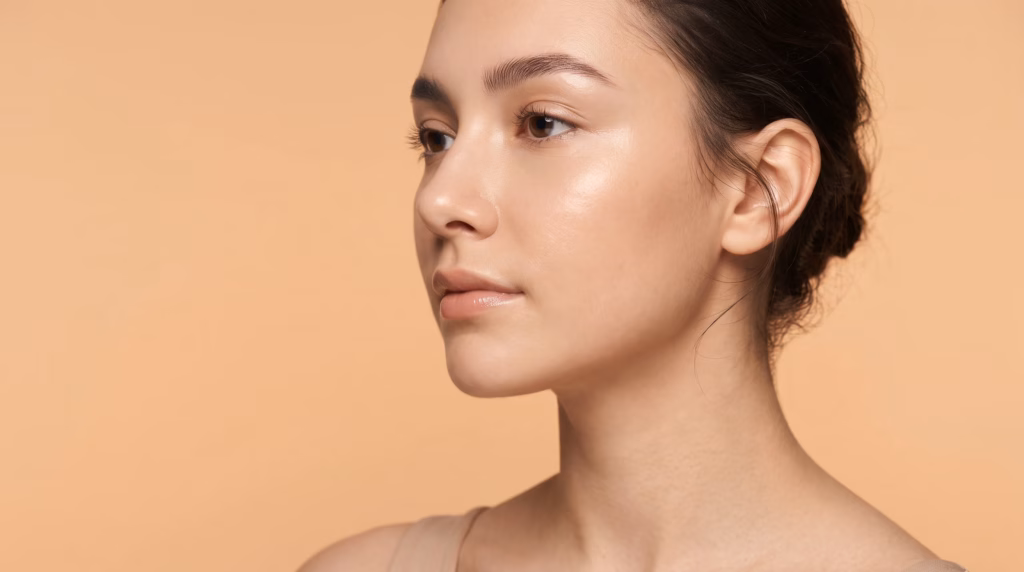 Side profile portrait illustrating open vs closed rhinoplasty results at Estevia Clinic